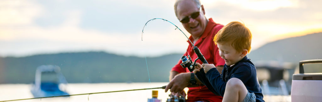 kid fishing with grandpa