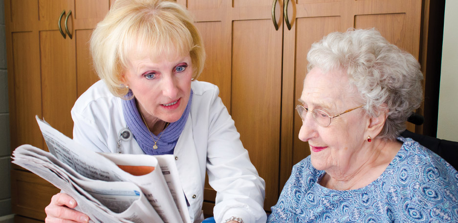 employee reading to resident