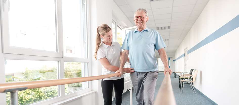 therapist with resident walking