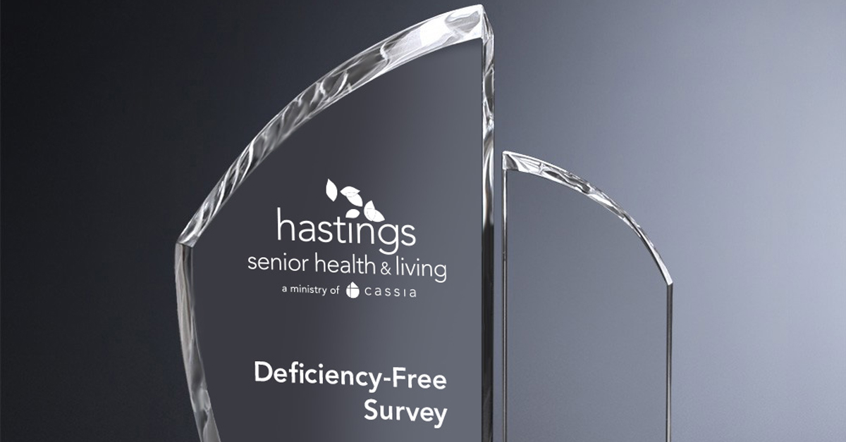Glass award engraved with the Hastings Senior Health & Living logo and the words “Deficiency-Free Survey.”