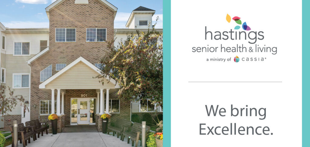 Exterior of Hastings Senior Health & Living with the community logo and tagline, “We bring Excellence.”
